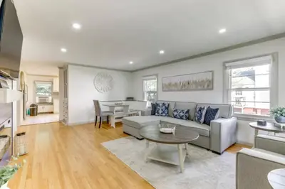 a living room with a couch and a table at Owls Nest Cozy Westfield Home with Fire Pit in Westfield