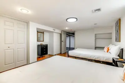 a bedroom with two beds and a tv at Owls Nest Cozy Westfield Home with Fire Pit in Westfield