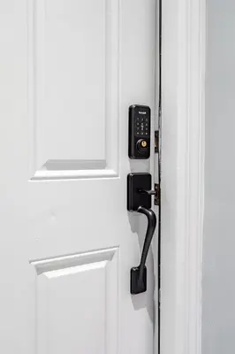 a door with a phone attached to it at Modern Escape 3BR Apt with Parking in New Rochelle