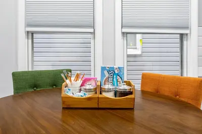 a table with a tray of utensils on it at Modern Escape 3BR Apt with Parking in New Rochelle