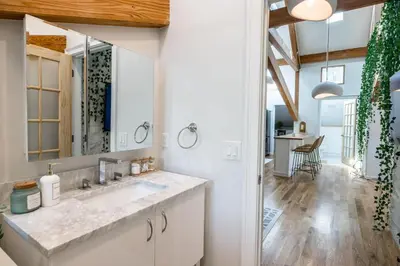 a bathroom with a sink and a mirror at Light filled zen 3BR Penthouse - 7 min to Westport in Weston