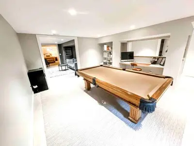 a living room with a pool table in it at Modern Westport Studio with Pool Table & Lounge in Westport