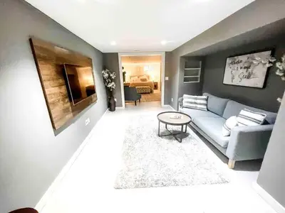 a living room with a couch and a table at Modern Westport Studio with Pool Table & Lounge in Westport