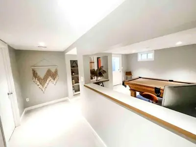 a living room with a pool table in it at Modern Westport Studio with Pool Table & Lounge in Westport