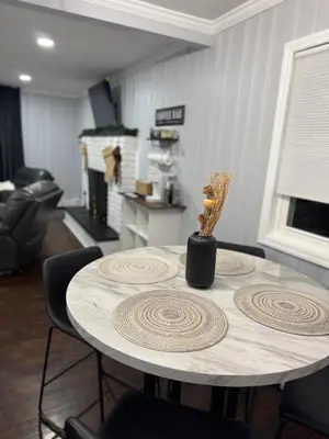 a table with a vase on it in a room at Vernon Cozy 2BD Pet-Friendly Mountain Creek in Vernon