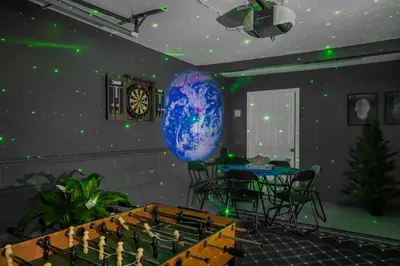 a room with a table and a globe on the wall at Enchanted Villa in Pocono Summit