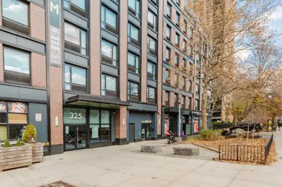 an empty street in front of a building at Blueground Clinton Hill gym AC nr park NYC-1674 in Brooklyn