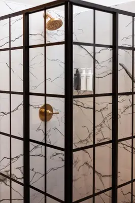 a room with a glass wall with a shelf at Doctor Sax House in Lenox