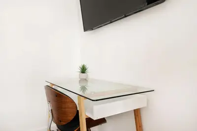 a glass table with a plant on top of it at 1290-10 New Renovated 2 Bedrooms in UES in New York