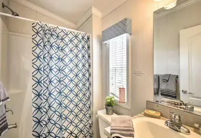 a bathroom with a sink and a shower curtain at Clydesdale Cottage by Equestrian House in Pleasant Mount