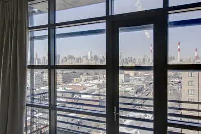 a view of the city from a window at Boro Hotel in Queens