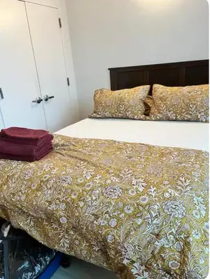 a bedroom with two beds with a bedspread on it at The Gilbert in New York