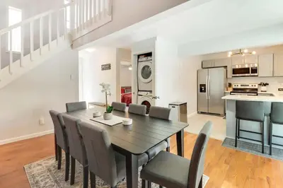 a dining room and kitchen with a table and chairs at Family fun at Casa Ledges in Tobyhanna