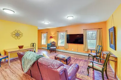 a living room with a couch and a table at Near Historic Sites Bright Hyde Park Guest Suite in Hyde Park