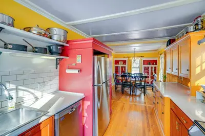 a kitchen with a red refrigerator and a dining room at 1 Mi to Dtwn Beautiful Home in Williamstown! in Williamstown