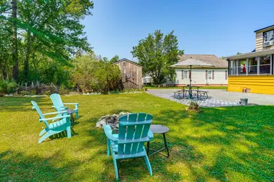 three blue chairs and a table in a yard at 1 Mi to Dtwn Beautiful Home in Williamstown! in Williamstown
