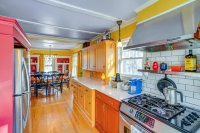 a kitchen with a stove and a dining room at 1 Mi to Dtwn Beautiful Home in Williamstown! in Williamstown