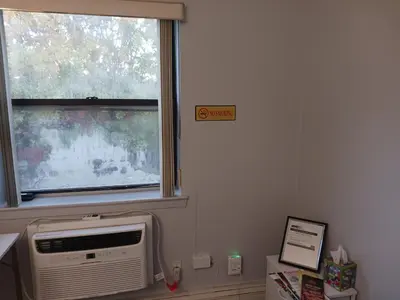 a window with a air conditioner in a room at Comfy Room in Fresh Meadows in Utopia