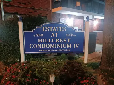 a sign for the entrance to a building at Comfy Room in Fresh Meadows in Utopia