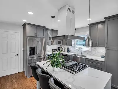 a kitchen with a white counter top and a sink at Suburban 3BR Stylish Oasis in Maplewood