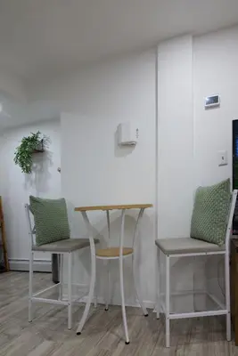 a table and two chairs in a room at City Gem in Long Island City