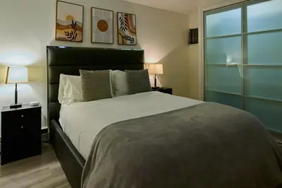 a bedroom with a large bed and a window at City Gem in Long Island City