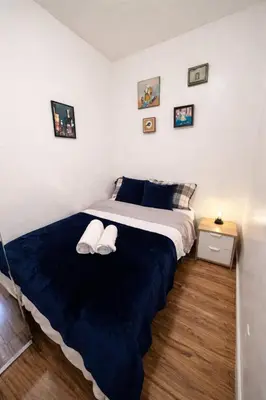 a bedroom with a bed with two white pillows on it at Next to Manhattan 2 Bedrooms Apartment - Subway 20 steps, Manhattan 1 Stop in Roosevelt Island