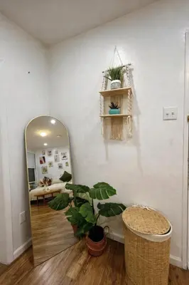 a room with a mirror and a potted plant at Next to Manhattan 2 Bedrooms Apartment - Subway 20 steps, Manhattan 1 Stop in Roosevelt Island