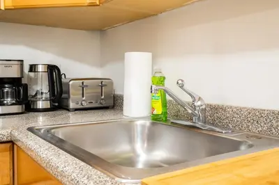a kitchen sink with a roll of paper towels at 49-3B Newly renovated 2BR WD Midtown East in New York