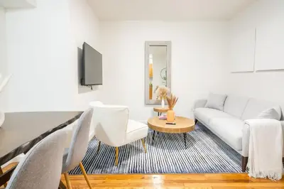 a living room with a white couch and a table at 49-3B Newly renovated 2BR WD Midtown East in New York