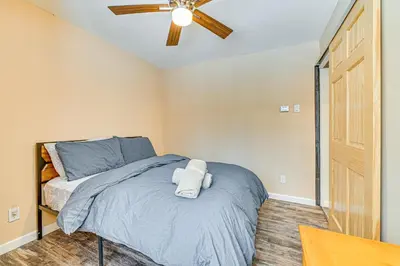 a bedroom with a bed with a ceiling fan at Ski, Hike and Golf Pet-Friendly Windham Retreat in Windham