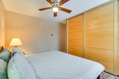 a bedroom with a bed and a ceiling fan at Ski, Hike and Golf Pet-Friendly Windham Retreat in Windham