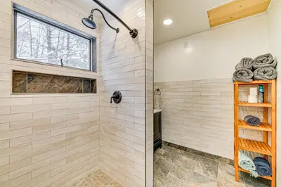 a bathroom with a shower and a window at Ski, Hike and Golf Pet-Friendly Windham Retreat in Windham