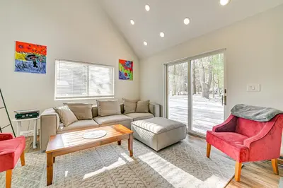 a living room with a couch and a table and chairs at Ski, Hike and Golf Pet-Friendly Windham Retreat in Windham