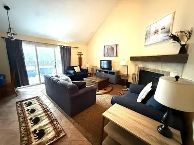 a living room with two couches and a fireplace at 2 BR Condo Mountain Views At Jiminy Peak- Sleeps 7 in Hancock
