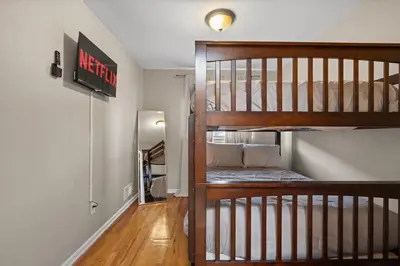 a staircase with a bunk bed in a room at Uptown Escape in Mount Vernon
