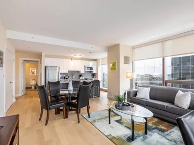 a living room with a couch and a table at Luxury Apt with Gym Downtown in Stamford
