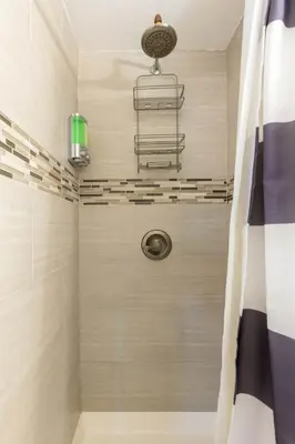 a bathroom with a shower with a shower head at Onix Studio in Long Island City