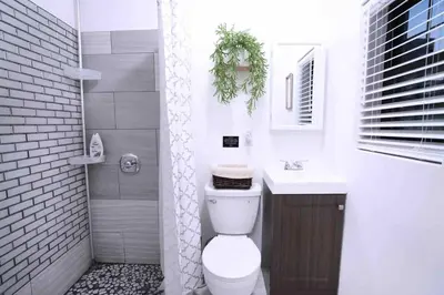 a bathroom with a toilet and a sink at Bocca Studio in Long Island City