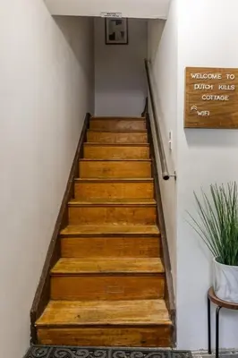 a stairway with wooden steps in a building at Bocca Studio in Long Island City