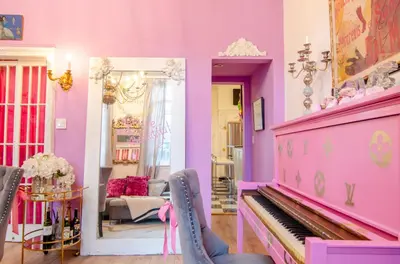a pink living room with a pink piano at One of a kind home with NYC views in Union City