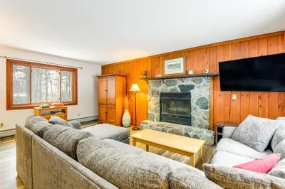 a living room with two couches and a fireplace at 7 Mi to Mt Snow Resort Family Home with Fire Pit! in Dover