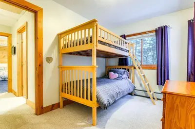 a bedroom with a bunk bed and a ladder at 7 Mi to Mt Snow Resort Family Home with Fire Pit! in Dover