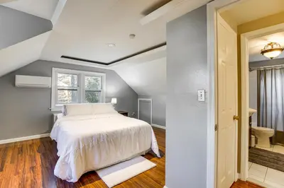 a bedroom with a white bed and a window at 3 Mi to Downtown Spacious White Plains Home in White Plains