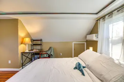 a bedroom with a bed and a window at 3 Mi to Downtown Spacious White Plains Home in White Plains