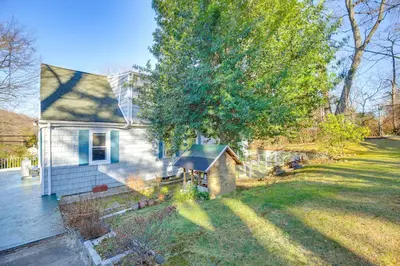 a house with a yard with a dog house at 3 Mi to Downtown Spacious White Plains Home in White Plains