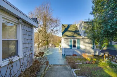 a house with a driveway next to a house at 3 Mi to Downtown Spacious White Plains Home in White Plains
