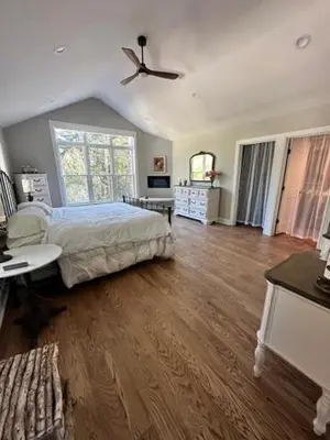 a bedroom with a bed and a ceiling fan at remember2giggle at gee mail to discuss and inquire in Avon