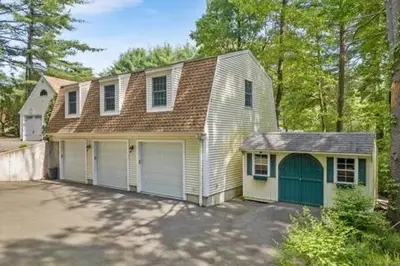a white house with a garage and a driveway at remember2giggle at gee mail to discuss and inquire in Avon