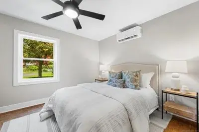 a white bedroom with a bed and a ceiling fan at remember2giggle at gee mail to discuss and inquire in Avon